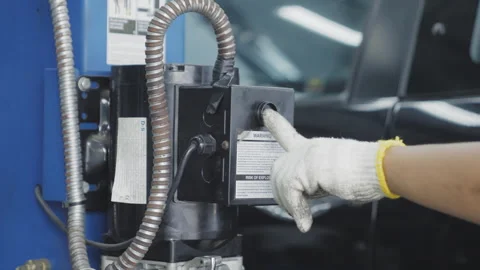 Close up worker hand use hoist to lift car 50fps Stock-Footage 246381487