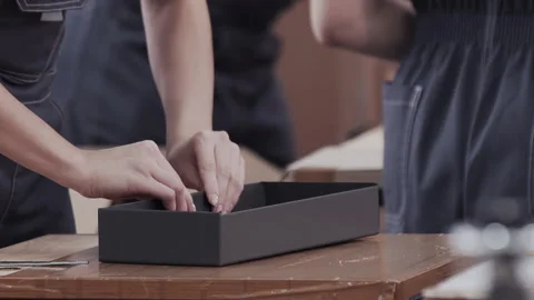 Close up worker hands laminated cardboard box. Modern factory of production 스톡 동영상 150606976