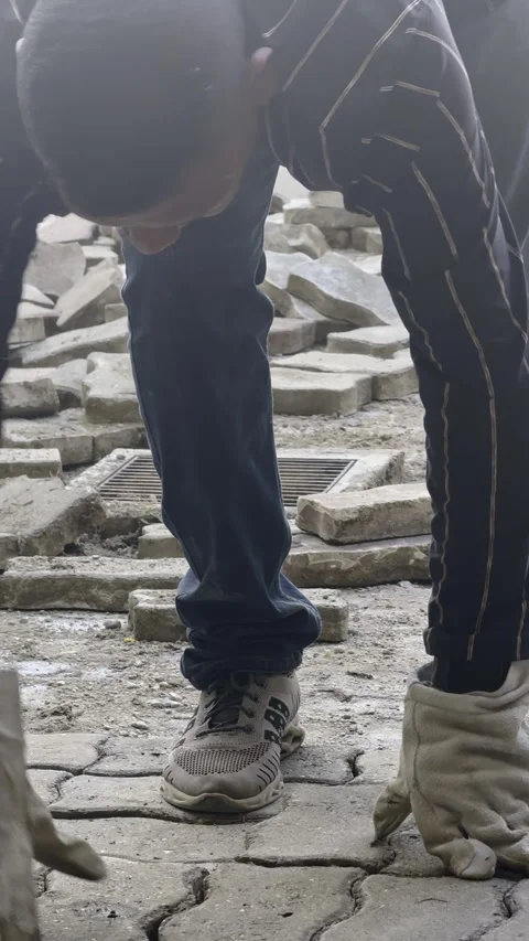 Close up of worker laying bricks  on the ground Stock Footage 274917247