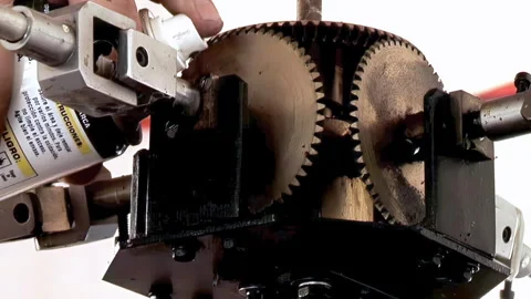 Close Up of Worker Lubricating Mechanism of Tower Clock Controller - 4K Stock Footage 341582332