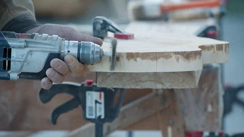 Close Up Of Worker Manually Using Carpentry Instrument To Finish Timber Stock Footage 233167738