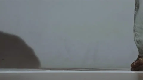Close-up, worker painting the floor in the studio with a paint roller with Video stock 337118671