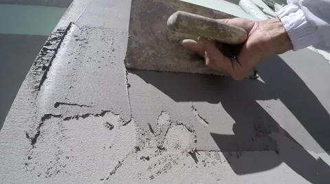Close-up worker plastered wall with a trowel Stock Footage 62707606