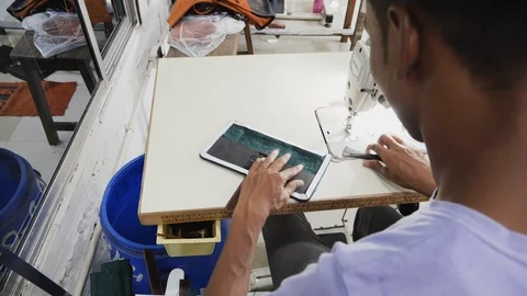 Close up of worker pressing leather in indoor factory in, Kalkata, India Stock-Footage 145037307