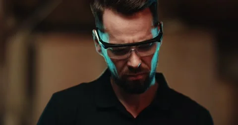 A close-up of a worker in protective glasses who is grinding a metal surface Video stock 166346081