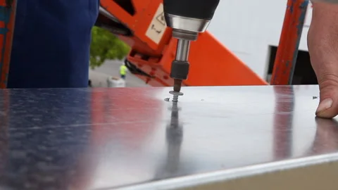 Close up of a worker screwing a screw Stock Footage 232398011