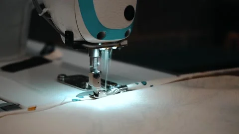 Close up of worker sewing design Stock Footage 135269680