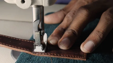 Close up of worker sewing in leather factory in slow motion, Kalkata, India Stock Footage 145036741