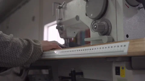 Close up of worker on sewing machine in slow motion, Portugal Stock-Footage 128963942