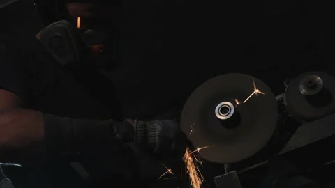 Close up of a worker sharpening metal with sparks. Stock Footage 150035522