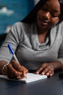 Close up of worker taking notes with pen on notebook Foto stock