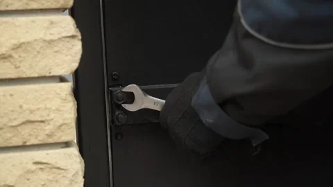 Close-up of a worker tightening nuts and bolts Video stock 261500460