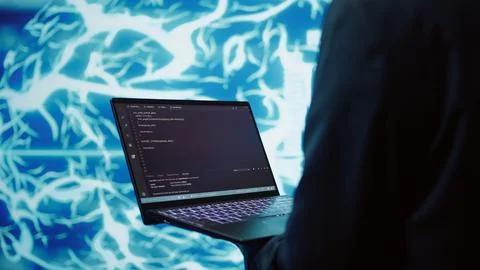 Close up of worker using AI deep learning and laptop to look at data Stock Photos