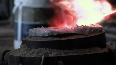 Close Up Of Worker Using Gas Torch To Heat Sealant Layer On Bell Mold - 4K Stock Footage 339693325