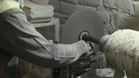 Close-up of a worker using sawing machine for cutting marble stone. Video stock 164957941