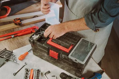 Close up of worker using tools organizer box in the workshop Stock Photos