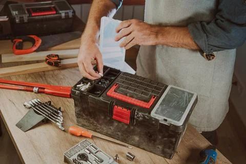 Close up of worker using tools organizer box in the workshop Stock Photos