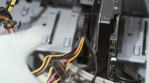 Close up worker in white gloves connect HDD disk to computer Stock Footage 162366820