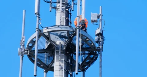 Close up of workers doing repairs on a telecommunication tower Stock Footage 125186311