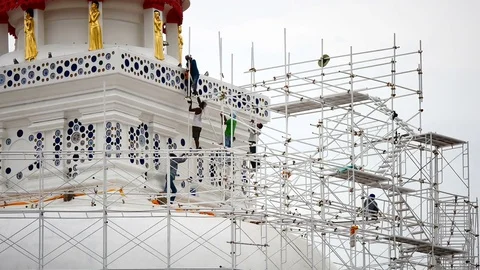 Close up of the workers group are restored. Repair of the old pagoda. Видео 77200798