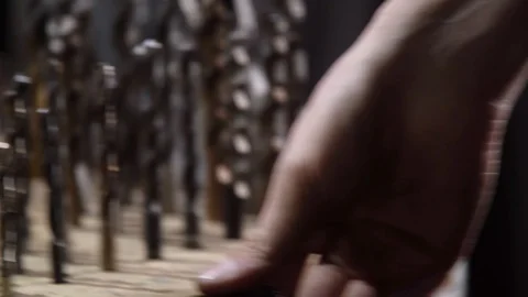 Close-up of a worker's hand choosing drills for work. The concept of production Video stock 128171455