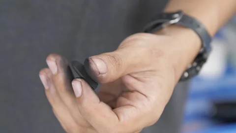 Close Up of Workers Hand Holding a Small Black chalk Tool with Dirty Fingert Stock Footage 321410065