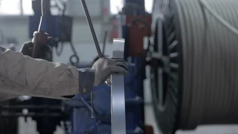 A close-up of the worker's hand is pressed by the electric lift button to move Stock Footage 150057109