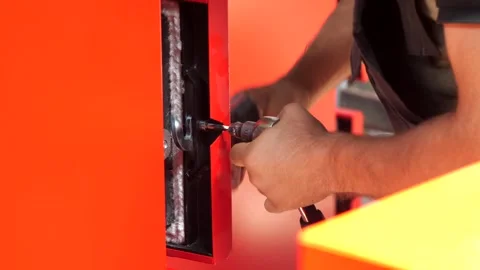 Close-up of a worker's hand in a robe who tightens the nut with a wrench. Stock Footage 246618241