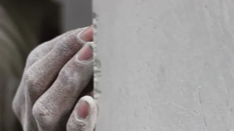 Close up of Worker's Hand  - Smooth Finishing a Wall with Sand Paper Stock Footage 43672043