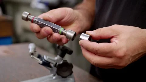 Close-Up of a Worker's Hands Assembling a Tool Component Stock Footage 318303937