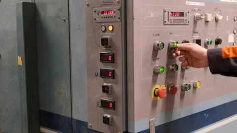 Close-up of a worker's hands pressing buttons on the control panel. Vídeo Stock 257436214