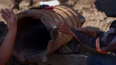 Close Up of Workers Welding Large Steel Pipe in Construction Trench 스톡 동영상 347006971