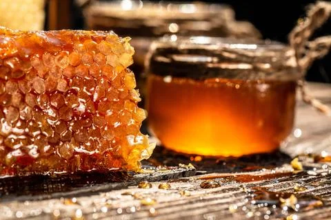 Close up. working bees on honey cells. Bees produce fresh, healthy, honey. .. Stock Photos