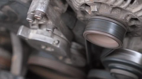 Close-up of a working car engine alternator pulley Stock Footage 327402770