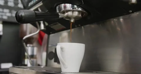 Close up of working coffee machine pouring fresh coffee into cup at cafe Stock Footage 335198367