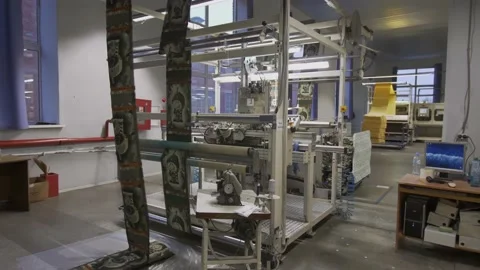 Close up at the working machine at the fabric and garment factory Video stock 150701712