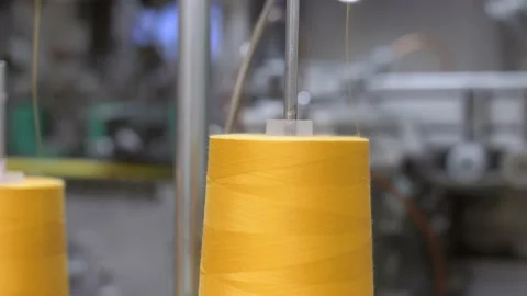 Close up at the working machine at the fabric and garment factory Stock Footage 150702096