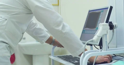 Close-up of working medic hands with pc and devices. Male doctor is working on a Stock Footage 83086974
