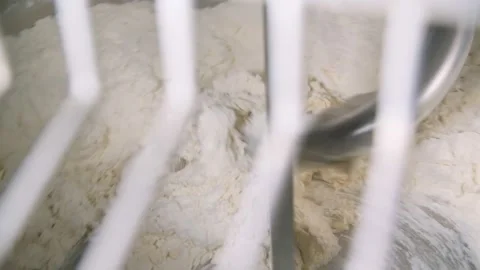 Close-up of working mixer through white grille while mixing dough Vídeos de archivo 155611579