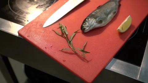 Close-up of working place in restaurant kitchen. Recipe of fish with lemon. Stock Footage 84037155