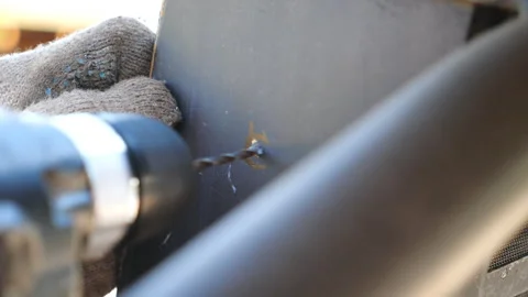 Close up on working process in carpentry workshop. Worker drilling hole in Stock Footage 329224719