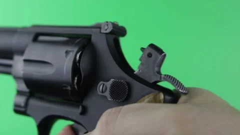 Close-up of the working revolver trigger In chroma key Stock Footage 150595627