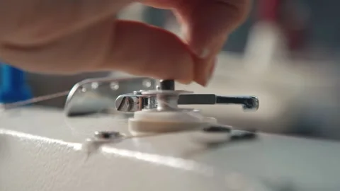 Close up working on sewing machine stitching side of fabric on a sewing machine Stock Footage 231015103