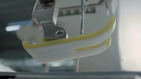 Close up working on sewing machine stitching side of fabric on a sewing machine Stock Footage 231015122