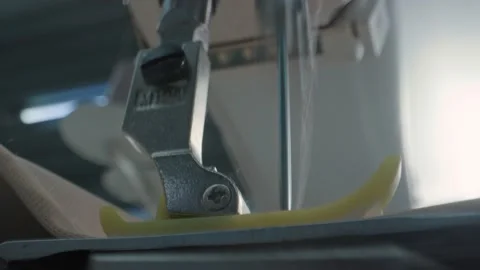 Close up working on sewing machine stitching side of fabric on a sewing machine Stock Footage 231015171
