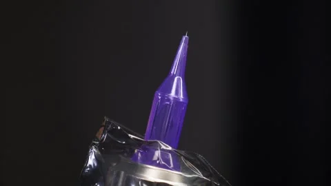 Close-up of a working tattoo machine with a needle. Stock Footage 278222969