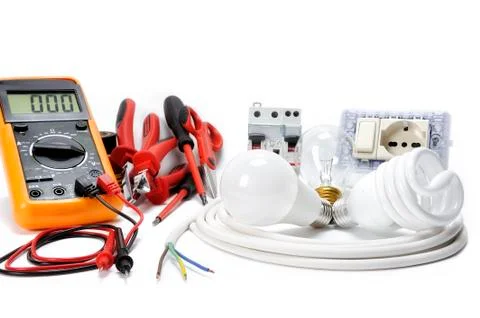 Close-up of working tools and components of the electrical system on white ba Stock Photos