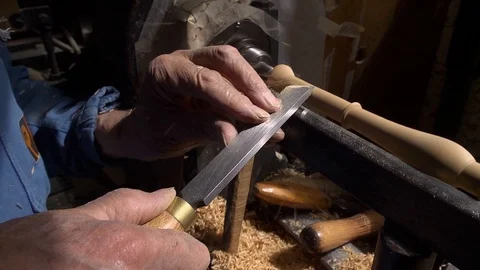 Close up of working on wood lathe using a chisel Stock Footage 126725822