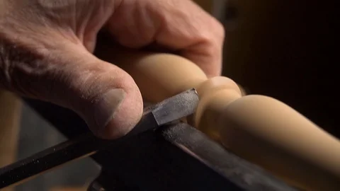 Close up of working on wood lathe using a chisel Stock Footage 126725957