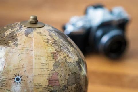 Close-up on a world map with a camera Stock Photos